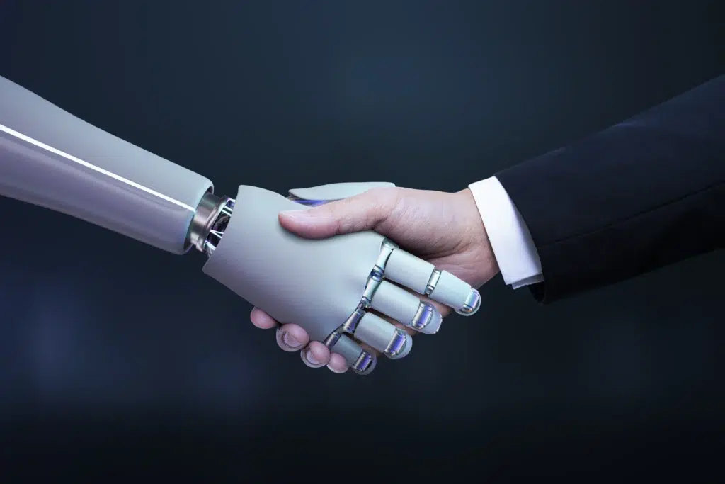 Close-up of human and robot hands shaking to symbolize trust and governance alignment in a generative AI procurement agreement.