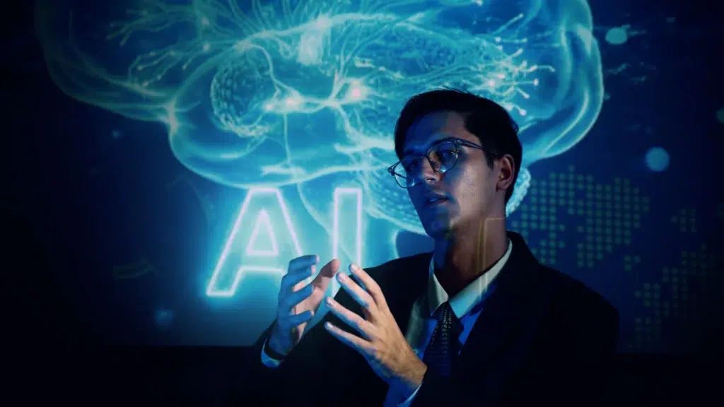 A business professional presenting digital brain graphics, illustrating why is responsible AI practices important to an organization’s strategy.