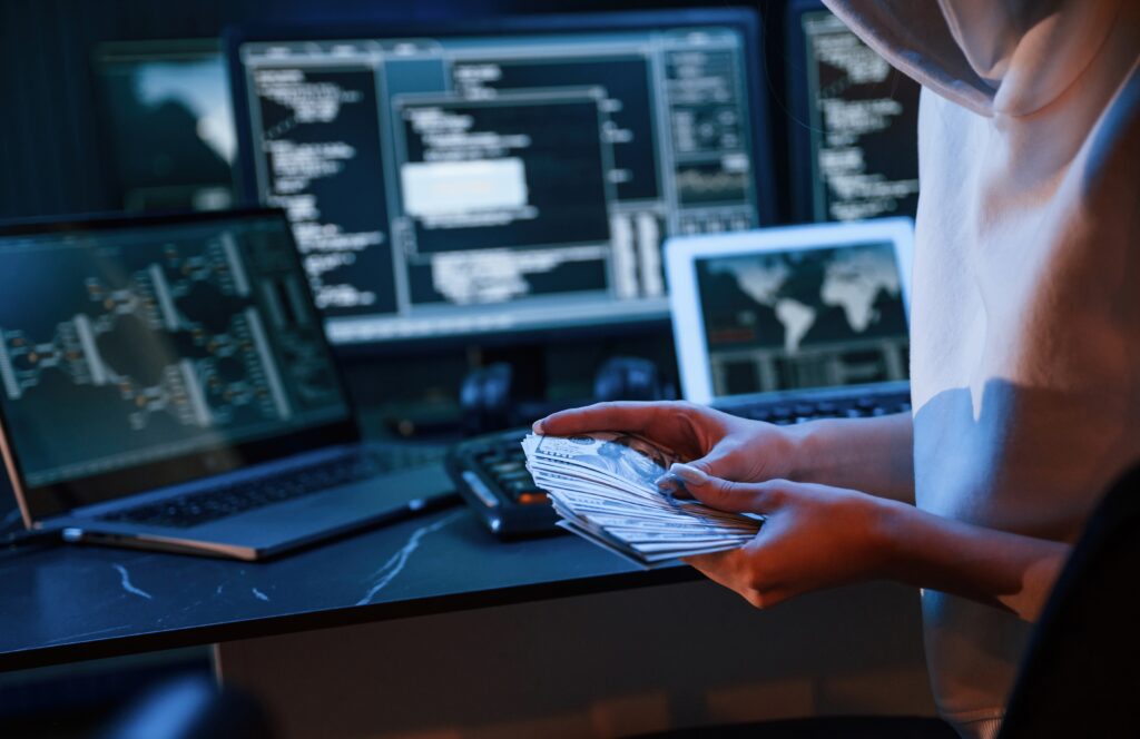 IT professional at a workstation applying what is risk management in cyber security to detect and respond to active threats